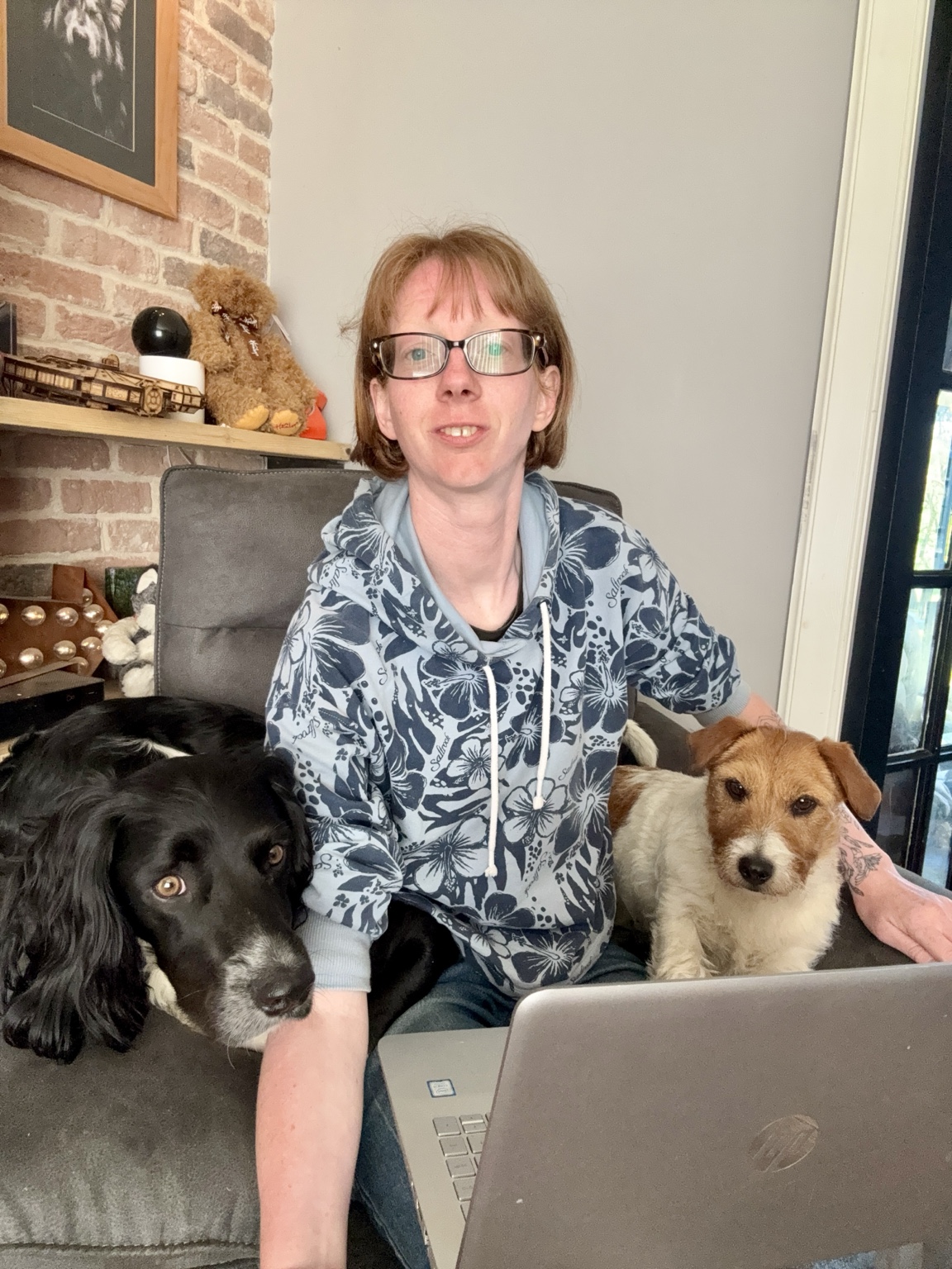 Dog trainer with Cookie and Oreo and a laptop